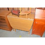 A Formica drop leaf table