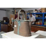 A copper watering can