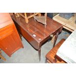 A 19th Century mahogany Pembroke table raised on t