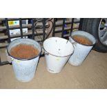 An enamel bucket and two galvanised planters