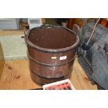 A wooden coopered well bucket