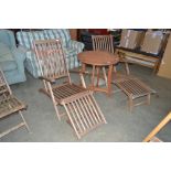 A pair of teak steamer chairs