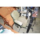 A tan-sad adjustable, metal based office chair