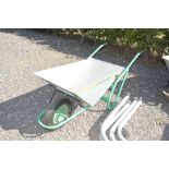 A galvanised wheel barrow