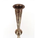 A late Victorian silver trumpet shaped spill vase, all over foliate decoration, weighted base,