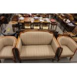 An early 20th Century three piece suite, comprising arched two seat settee raised on cabriole