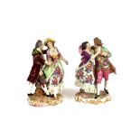 A pair of 19th Century Meissen style continental porcelain figures, depicting dancing couples in