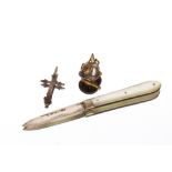 A miniature German Pickelhaube, approx. 2cm x 1.5cm; a mother of pearl and silver pen knife,