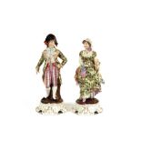A pair of 19th Century German porcelain figures, of a lady and gallant wearing brightly coloured
