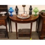 A 19th Century mahogany and box wood strung demi-lune hall table, raised on square section