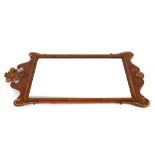 A walnut framed wall mirror, in the 18th Century style having gilt decoration and Prince of Wales