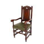 A set of six carved oak Jacobean style dining chairs, having scrolled cresting rails, panelled