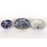 A 19th Century oriental scenic decorated plate, in under glaze blue; a 20th Century Chinese bowl