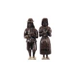 A pair of antique carved oak figures, depicting a man playing pipes and a woman playing a lute, 34cm