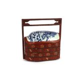 An Oriental red lacquer and blue and white porcelain sectional wedding box, 49cm high x 47cm wide