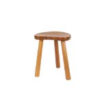 A Mouseman oak stool, of kidney shape raised on chamfered tapering supports, 36cm high x 30cm wide