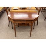 A George III mahogany and satinwood cross banded card table, having fold over canted top rasied on