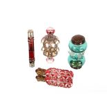 A Victorian ruby glass and silver mounted scent bottle, having coiled snake decoration inset with