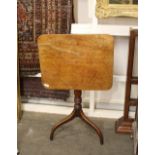 A 19th Century mahogany rectangular tilt top occasional table, raised on ring turned column and