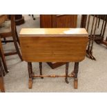 An Edwardian walnut Sutherland table, raised on turned column supports, 60cm