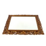 A 19th Century gilt framed wall mirror, in the Florentine manner having pierced foliate