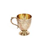 A late Victorian silver Christening mug, having foliate decoration and monogram cartouche by