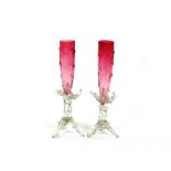 A pair of cranberry glass tapering posy vases, with raised decoration and clear glass icicle