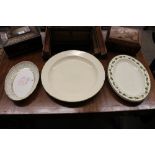 An 18th Century cream ware charger, 37cm dia.; a pair of Wedgwood cream ware oval platters with