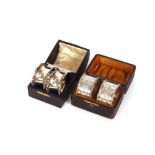 A pair of late Victorian cased silver napkin rings, having foliate decoration, Sheffield 1899; and