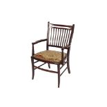 An Edwardian inlaid mahogany salon elbow chair, having railed back, upholstered seat panel raised on