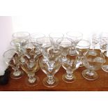 Fifteen antique glass rummers, various, raised on baluster stems and circular spread bases