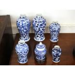 A pair of Chinese blue and white baluster vases, dragon decoration and four character mark to base