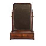 A 19th Century walnut swing toilet mirror, raised on a two drawer box base with ogee bracket feet,