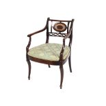 A 19th Century mahogany elbow chair,having wicker back panel and seat raised on cabriole front