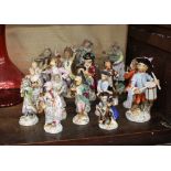A collection of Sitzendorf and other porcelain monkey band figures; various other continental