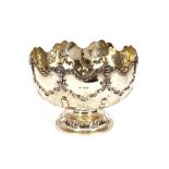 A late Victorian silver rose bowl,  with shaped rim, decorated embossed masks, and trailing leaves