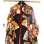 A long ceremonial kimono, in bright colours and heightened with gilt thread