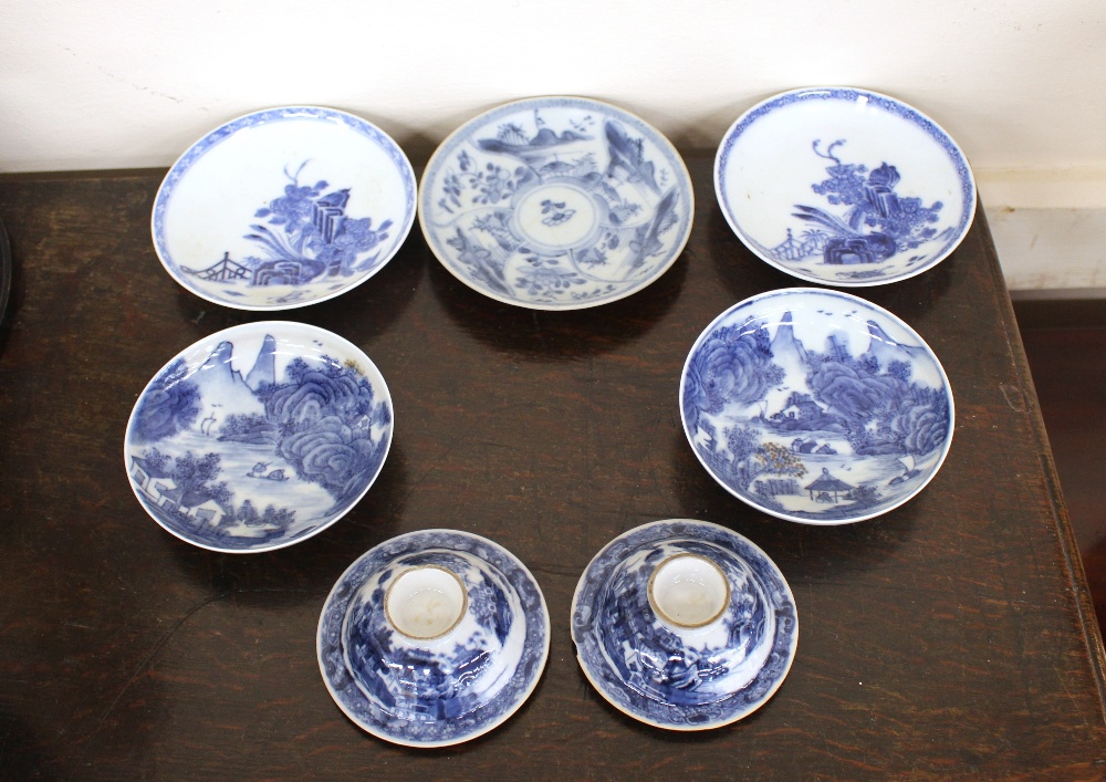 A pair of 19th Century Chinese blue and white shallow dishes, decorated with rural scenes, four