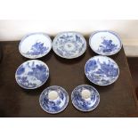 A pair of 19th Century Chinese blue and white shallow dishes, decorated with rural scenes, four