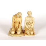 Two late 19th / early 20th Century carved alabaster figures of seated maidens, 20cm high