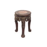 A small carved hardwood Chinese cachepot stand, the circular beaded top with marble insert raised on