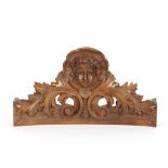 A 19th Century carved fruit wood pediment,with cherub and acanthus decoration, 38cm long x 21cm