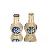 A small pair of baluster vases, decorated roundels on a crackle glazed ground, four character