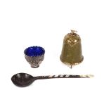 A 19th Century Ottoman sherbet spoon; and an Ottoman silver coffee cup with blue glass liner; and