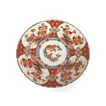A large Japanese Imari charger, having scallop border decorated in the traditional manner,
