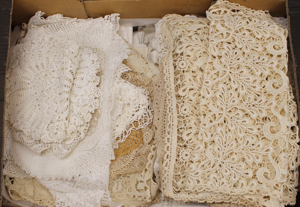 A quantity of various lace doilies, other table na