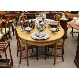 A 19th Century mahogany boxwood strung and cross banded D end dining table, raised on square section