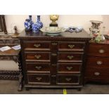 An 18th Century oak moulded panel chest, of four long drawers with brass butterfly handles and