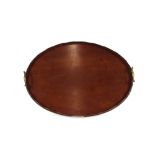 An Edwardian mahogany oval tea tray, with brass carrying handles, 58cm