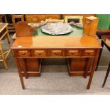 A mahogany hall table, of narrow proportions fitted five pharmacy drawers and raised on chamfered